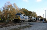 CSX 7728 leads a train southbound (compass west)